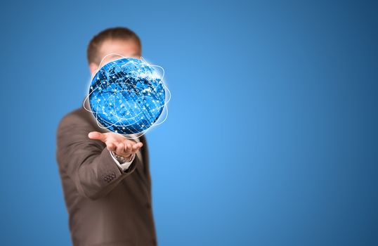 Glowing lines and Earth. Businessman in suit as backdrop. Elements of this image are furnished by NASA