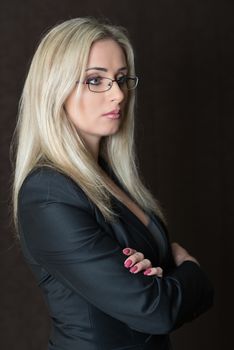 Portrait of elegantly dressed young gorgeous blond business woman.