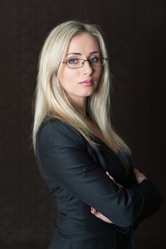 Portrait of elegantly dressed young gorgeous blond business woman.