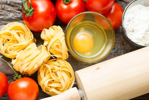 Set of ingredients for cooking healthy mediterranean dish on old wooden table