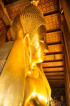 Reclining Buddha gold statue. Wat Pho, Bangkok, Thailand, travel in Asia