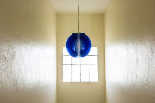 the beautiful blue round stylish lampshades hang from ceiling in the house