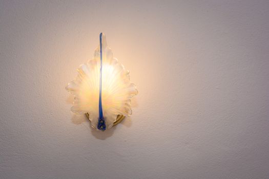 wall lamp mounted on wall with copy space for text