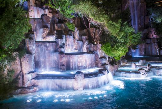 LAS VEGAS - MARCH 15 : Waterfall in front of the entrance to the Wynn Hotel and Casion on March 15, 2014 in Las Vegas. The hotel has 2,716 rooms and it opened in 2005.