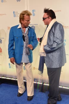 LAS VEGAS - MARCH 21: Former magicians Siegfried (L) and Roy arrives at Cirque du Soleil's annual 'One Night for One Drop' at the Mandalay Bay Resort and Casino on March 21, 2014 in Las Vegas, Nevada