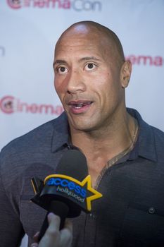 LAS VEGAS, NV - MARCH 24:  Dwayne Johnson (The Rock) arrives at the 2014 CinemaCon Paramount opening night presentation at Caesars Palace on March 24, 2014 in Las Vegas, Nevada