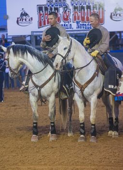 LOGANDALE , NEVADA - APRIL 10 : Cowboys Participates in the opening ceremony of the Clark County Rodeo held in Logandale Nevada , USA on April 10 , 2014 