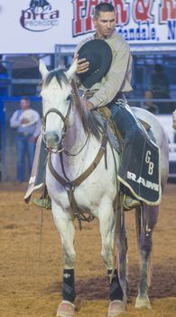 LOGANDALE , NEVADA - APRIL 10 : Cowboy Participates in the opening ceremony of the Clark County Rodeo held in Logandale Nevada , USA on April 10 , 2014 