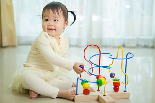 Portrait of little asian girl in home