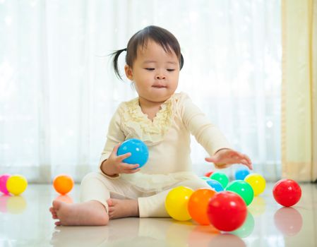 Portrait of little asian girl in home