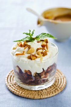 Chocolate cake with caramel sauce,cream and nut