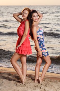 Summer, sea. Cute girls on the beach