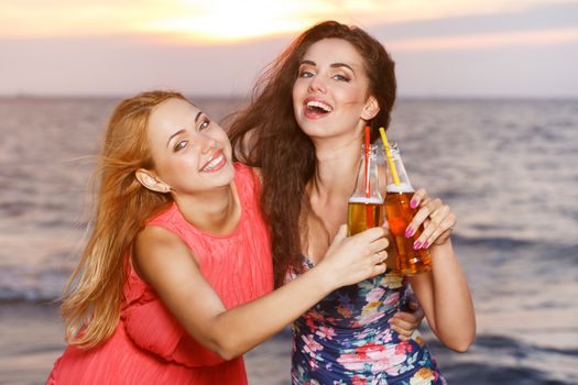 Summer, sea. Cute girls on the beach