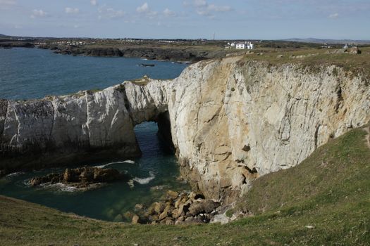White rock through cave, geological feature, on the Wales coast path, Rhoscolyn, Anglesey, Wales, UK.