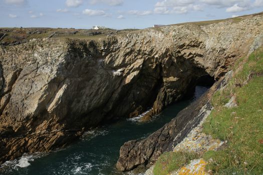 The Bwa Du through cave on the Wales coast path, Rhoscolyn, Anglesey, Wales, UK.