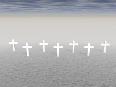 Seven white crosses planted in the ground by snuset