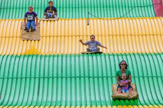 DES MOINES, IA /USA - AUGUST 10: Unidentified people on jumbo slide at the Iowa State Fair on August 10, 2014 in Des Moines, Iowa, USA.