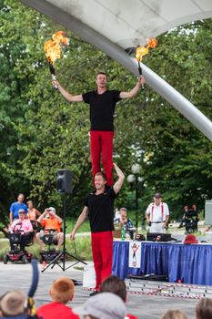 DES MOINES, IA /USA - AUGUST 10: Red Trouser Show acrobats David Graham, below, and Tobin Renwick at the Iowa State Fair on August 10, 2014 in Des Moines, Iowa, USA.