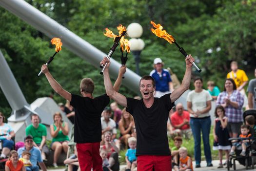 DES MOINES, IA /USA - AUGUST 10: Red Trouser Show jugglers Tobin Renwick facing ahead and David Graham at the Iowa State Fair on August 10, 2014 in Des Moines, Iowa, USA.
