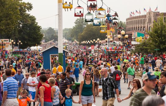 DES MOINES, IA /USA - AUGUST 10: Attendees at the Iowa State Fair. Thousands of people filling the midway at the Iowa State Fair on August 10, 2014 in Des Moines, Iowa, USA.