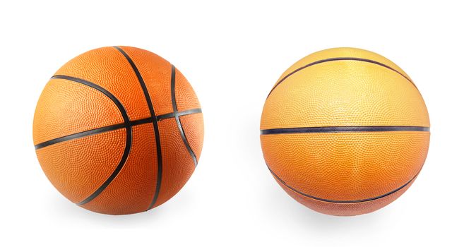 Two basketballs on plain background 