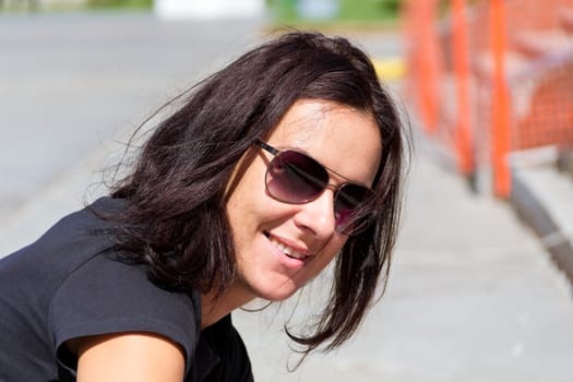 Photo of young beautiful woman in sunglasses