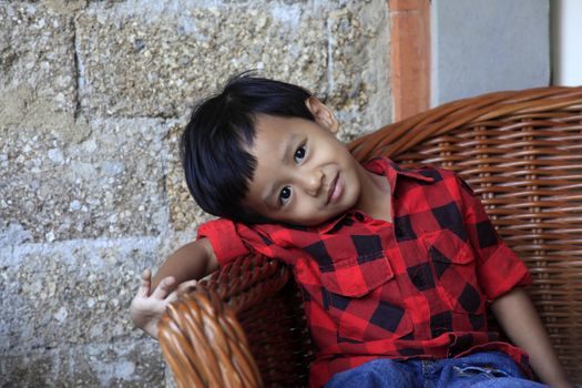 Photo of handsome asian boy with smiling. Indonesia, Bali
