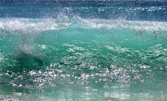 Big ocean wave breaking the shore
