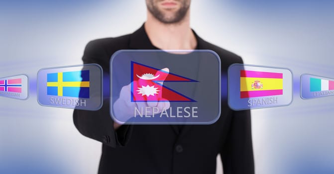 Hand pushing on a touch screen interface, choosing language or country, Nepal