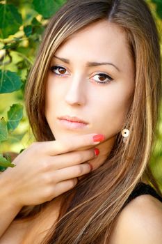 Portrait of a charming lady woman girl outdoor with green background
