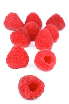 Arrangement of Perfect Ripe Raspberries with Water Drops isolated on white background