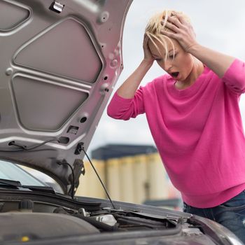 Stressed Young Woman with Car Defect. Engine breakdown.