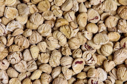 Background of peeled dried chestnuts