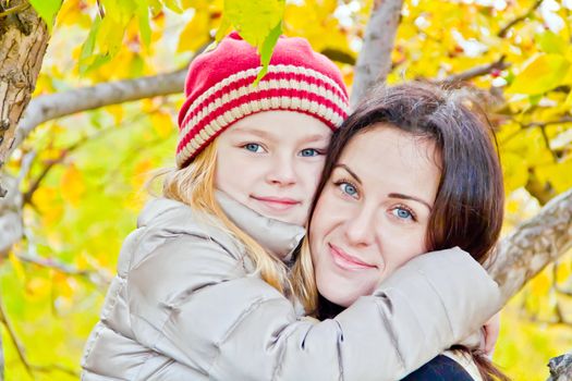 Photo of mother and daughter in autumn