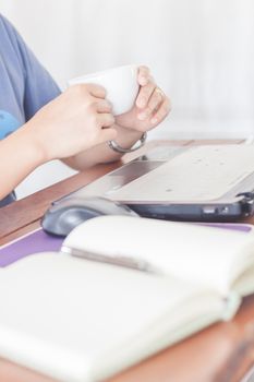 Woman drinking hot coffee, stock photo