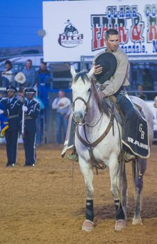 LOGANDALE , NEVADA - APRIL 10 : Cowboy Participates in the opening ceremony of the Clark County Rodeo held in Logandale Nevada , USA on April 10 , 2014 