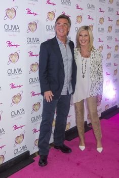 LAS VEGAS - APRIL 11: Entertainer Olivia Newton-John and her husband, John Easterling, attends the grand opening of her residency show 'Summer Nights' at Flamingo Las Vegas on April 11, 2014 