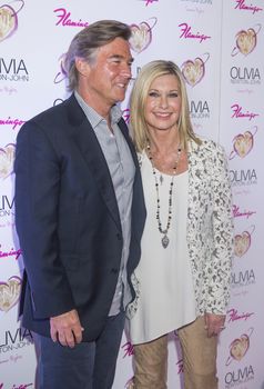 LAS VEGAS - APRIL 11: Entertainer Olivia Newton-John and her husband, John Easterling, attends the grand opening of her residency show 'Summer Nights' at Flamingo Las Vegas on April 11, 2014 