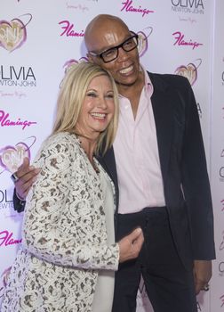LAS VEGAS - APRIL 11: Entertainer Olivia Newton-John (L) and television personality RuPaul attends the grand opening of her residency show 'Summer Nights' at Flamingo Las Vegas on April 11, 2014 