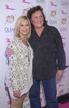 LAS VEGAS, - APRIL 11: Entertainer Olivia Newton-John (L) and actress Dot Jones attends the grand opening of her residency show 'Summer Nights' at Flamingo Las Vegas on April 11, 2014