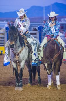 LOGANDALE , NEVADA - APRIL 10 : cowgirls Participates in the opening ceremony of the Clark County Rodeo held in Logandale Nevada , USA on April 10 , 2014 