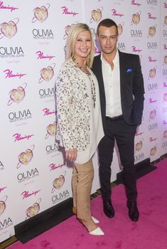 LAS VEGAS, - APRIL 11: Entertainer Olivia Newton-John (L) and actress Joey Lawrence attends the grand opening of her residency show 'Summer Nights' at Flamingo Las Vegas on April 11, 2014