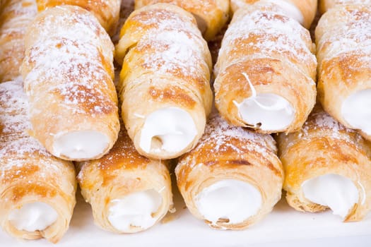 tube of pastry filled with snow, very sweet cookies, traditional czech sweet