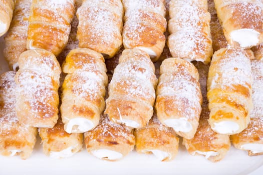 tube of pastry filled with snow, very sweet cookies, traditional czech sweet