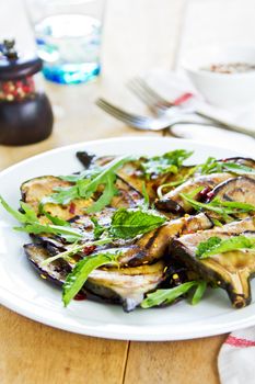 Grilled Aubergine salad with dried chili flake and Rocket