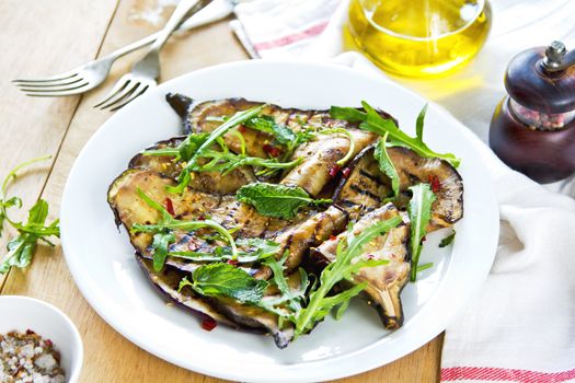 Grilled Aubergine salad with dried chili flake and Rocket