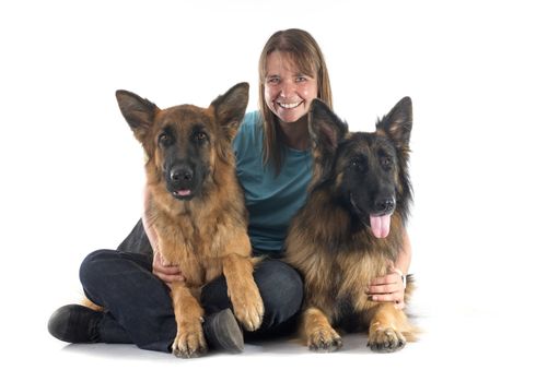 woman and dogs in front of white background