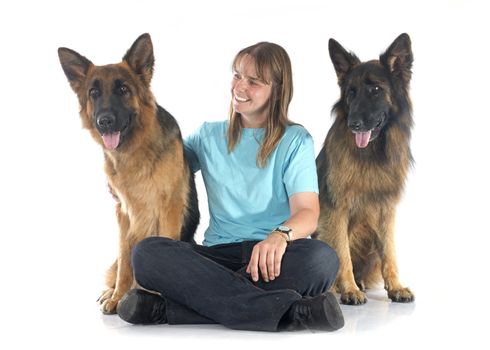 woman and dogs in front of white background