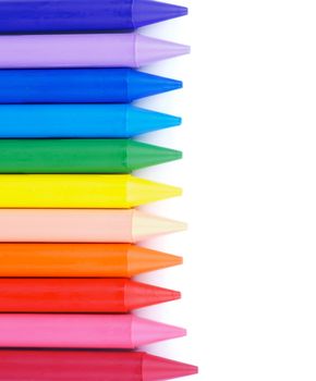 Vertical Frame of Multicolored Polymeric Crayons isolated on white background