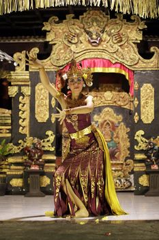 BALI, JIMBARAN, INDONESIA - 23 JULY, 2012:  Portrait of dancing girl in national clothes. Traditional daily representation in Jimbaran to Bali 23 July 2012, Indonesia